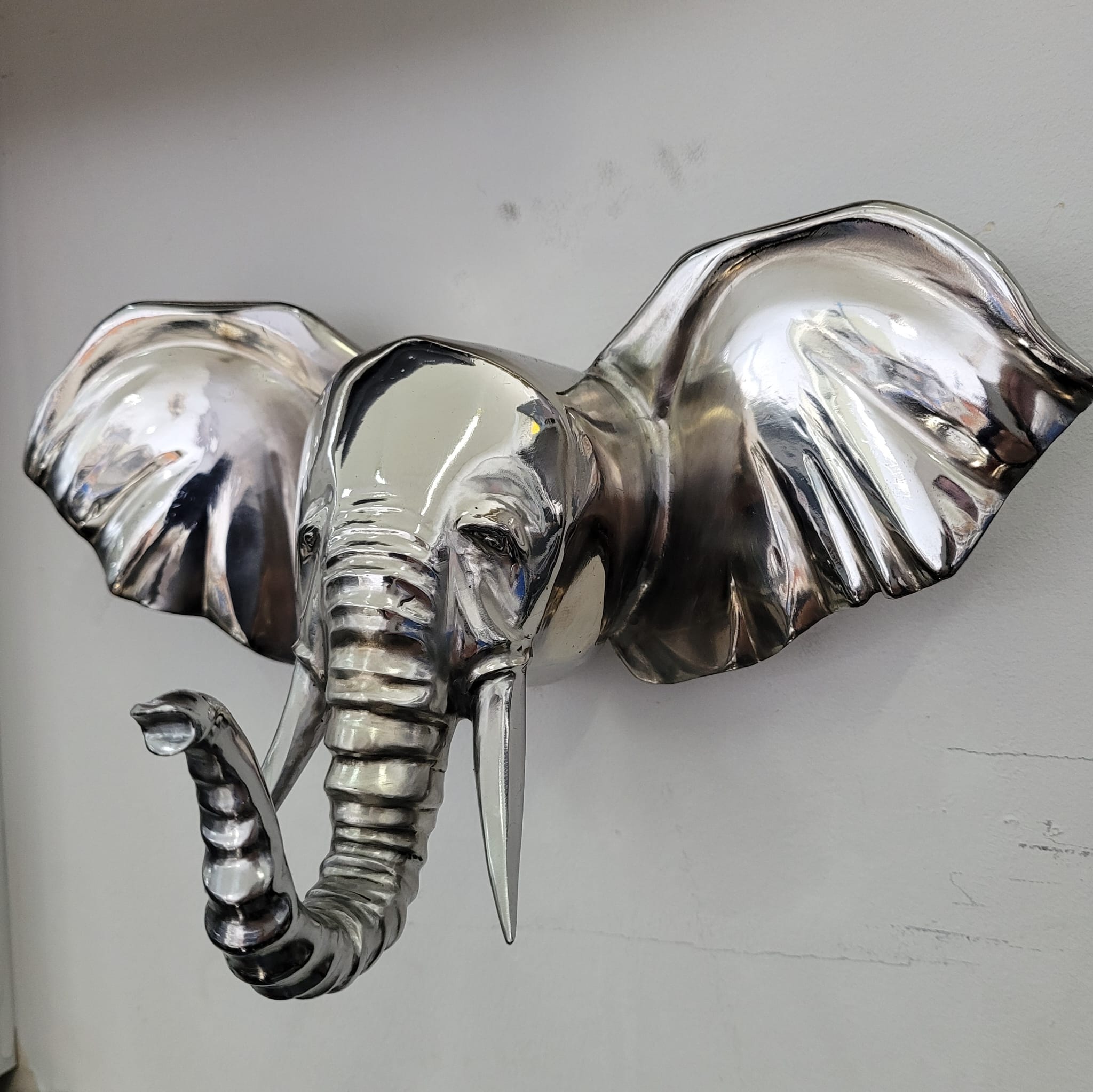 Polished chrome elephant sculpture by Piotr Mateusiak